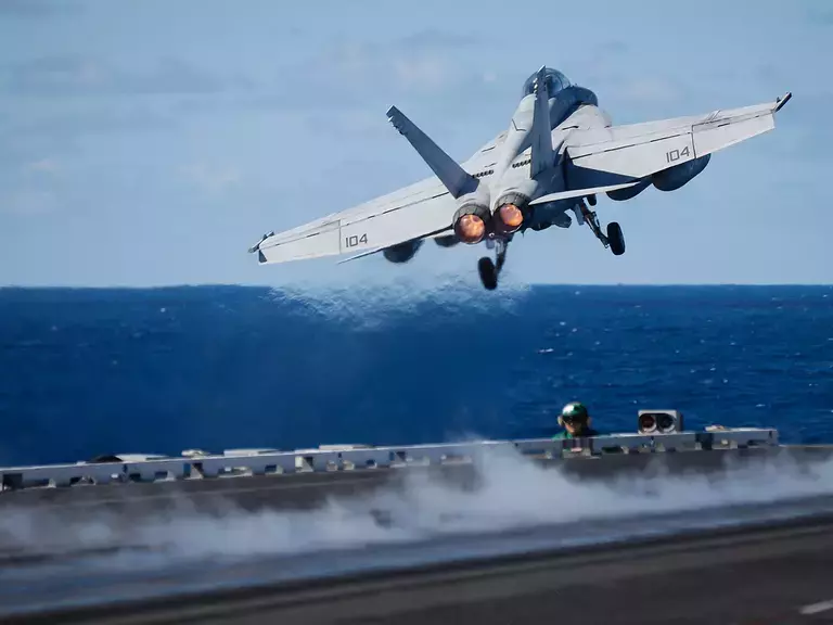 Military Jet Taking Off from an aircraft carrier